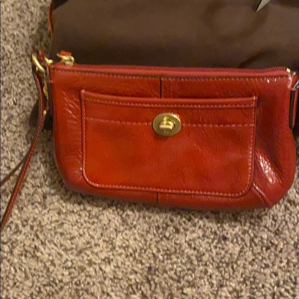 Coach red patent leather wristlet